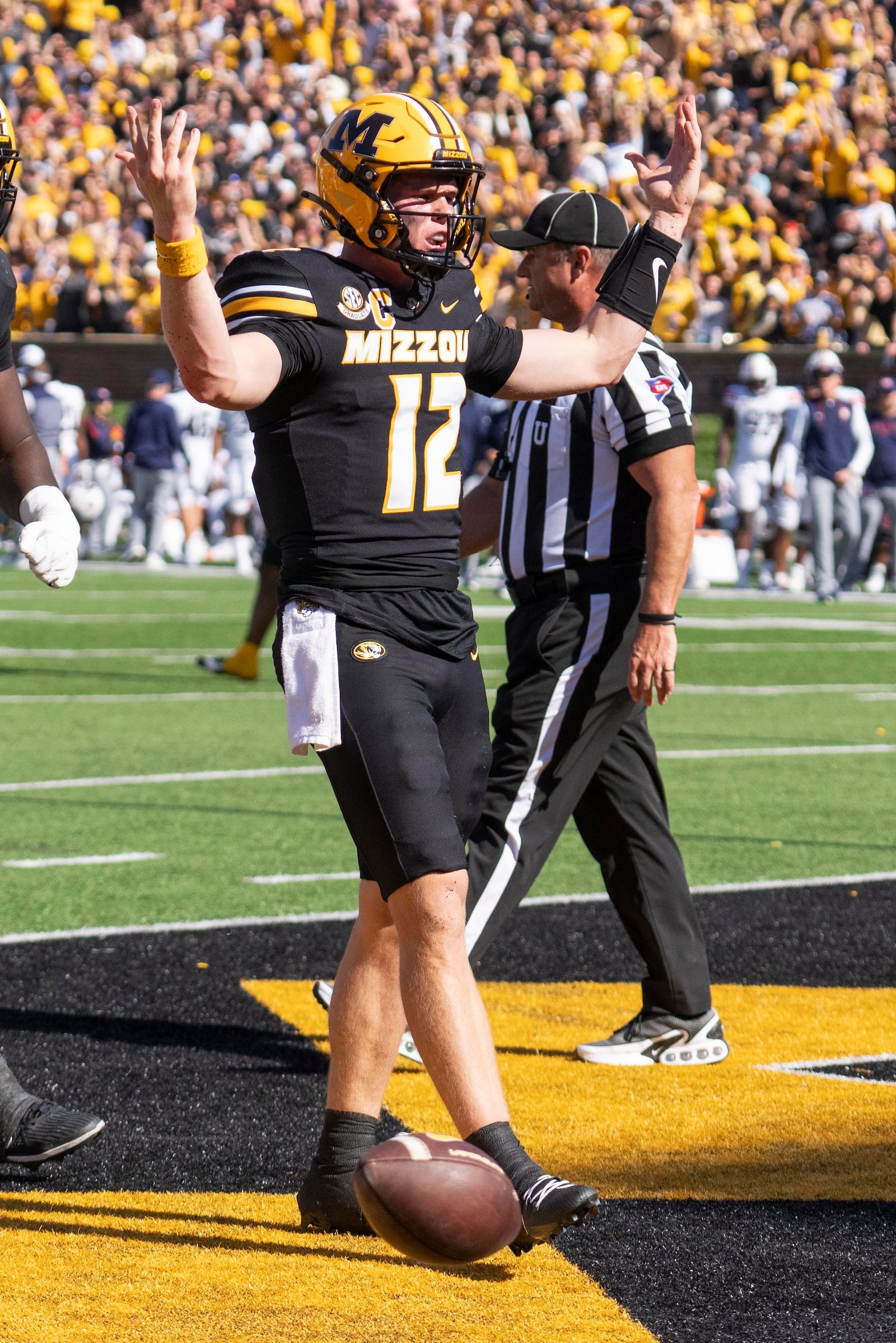 Missouri quarterback Brady Cook celebrates scoring on a two point conversion during the second half of an NCAA college football game against Auburn Saturday, Oct. 19, 2024, in Columbia, Mo. Missouri won 21-17. (AP Photo/L.G. Patterson)