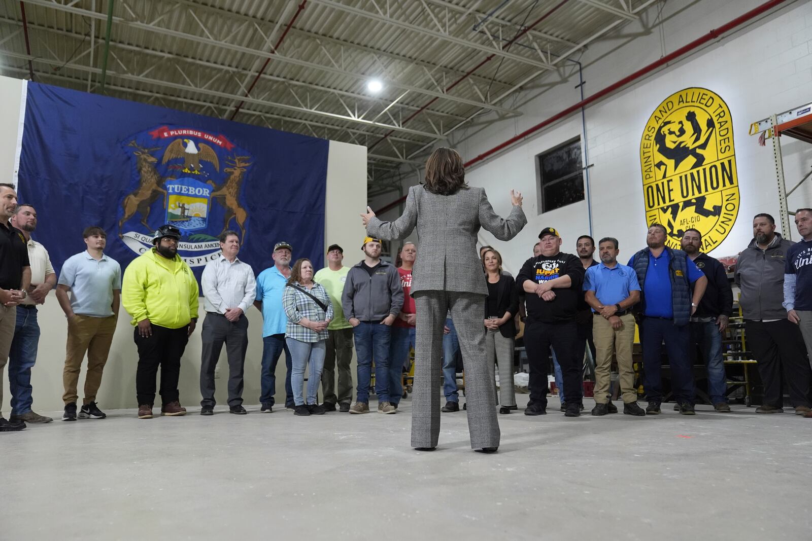 Democratic presidential nominee Vice President Kamala Harris tours the International Union of Painters and Allied Trades District Council 1M facilities, Monday, Oct. 28, 2024, in Warren, Mich. (AP Photo/Paul Sancya)