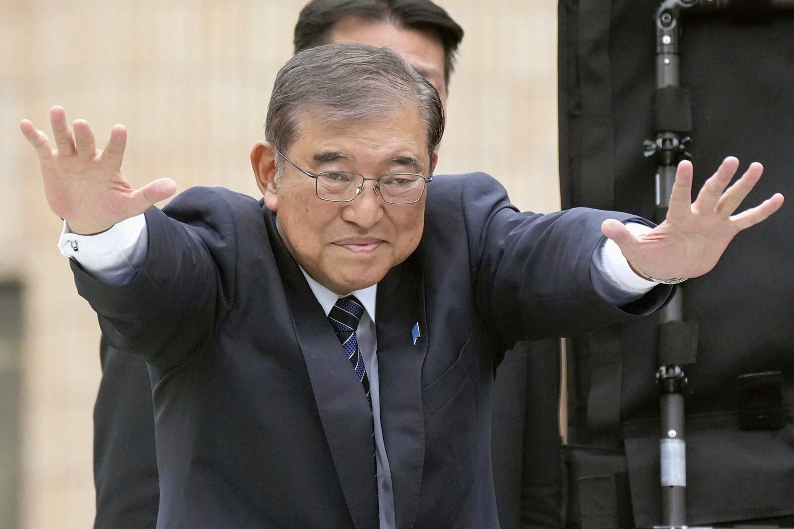 Japan's Prime Minister and head of the governing Liberal Democratic Party Shigeru Ishiba waves during a campaign for a parliamentary election in Tokyo, Japan, Saturday, Oct. 26, 2024. (Kyodo News via AP)