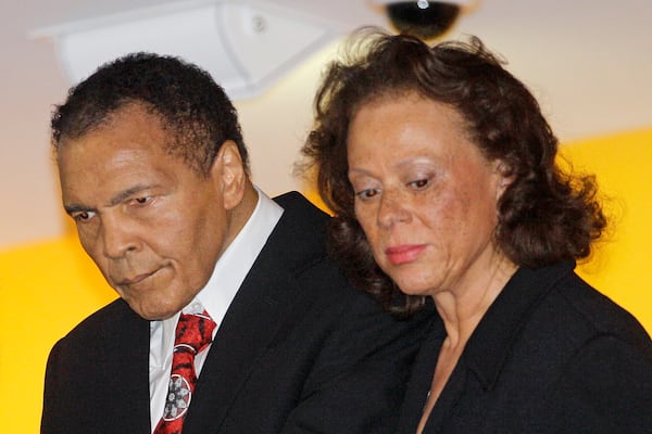 FILE - Boxing great Muhammad Ali, left appears with his wife, Lonnie at a celebration for his 70th birthday at the Muhammad Ali Center in Louisville, Ky., on Jan. 14, 2012. (AP Photo/Mark Humphrey, File)