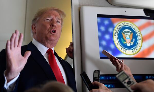 FILE - President Donald Trump talks to reporters while in flight from Billings, Mont., to Fargo, N.D., Sept. 7, 2018. (AP Photo/Susan Walsh, File)