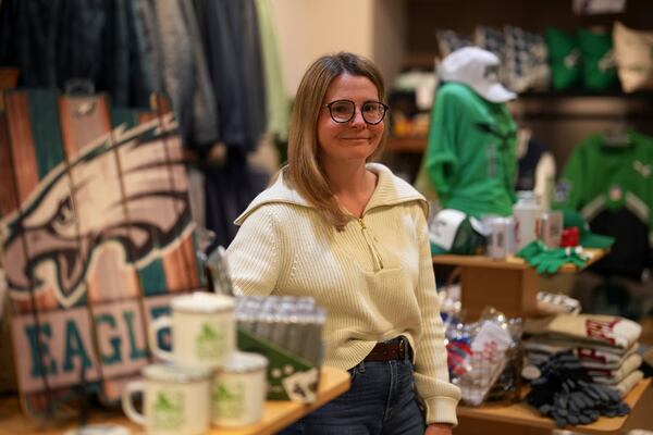 Nicole Beltz poses for a photograph at her shop, Serendipity, Wednesday, Dec. 11, 2024, in Philadelphia. (AP Photo/Matt Slocum)