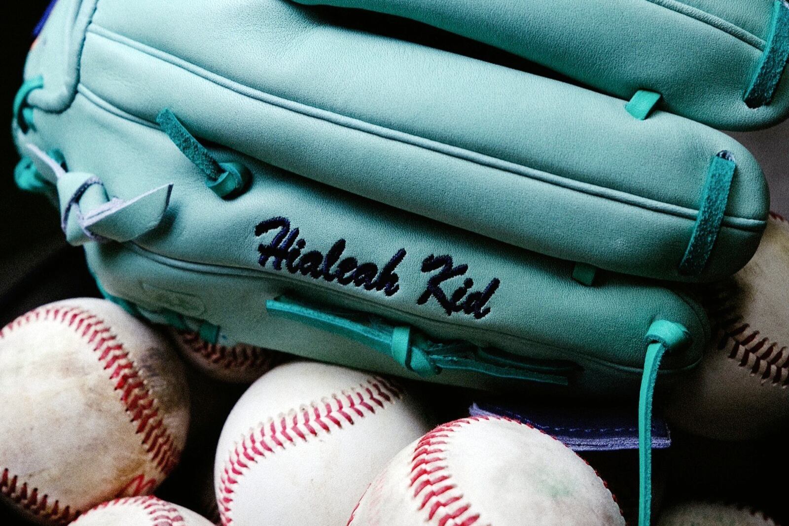 This image provided by Brent Habert, shows New York Yankees' Nestor Cortes' mint-colored costumed designed baseball glove. (Brent Habert via AP)