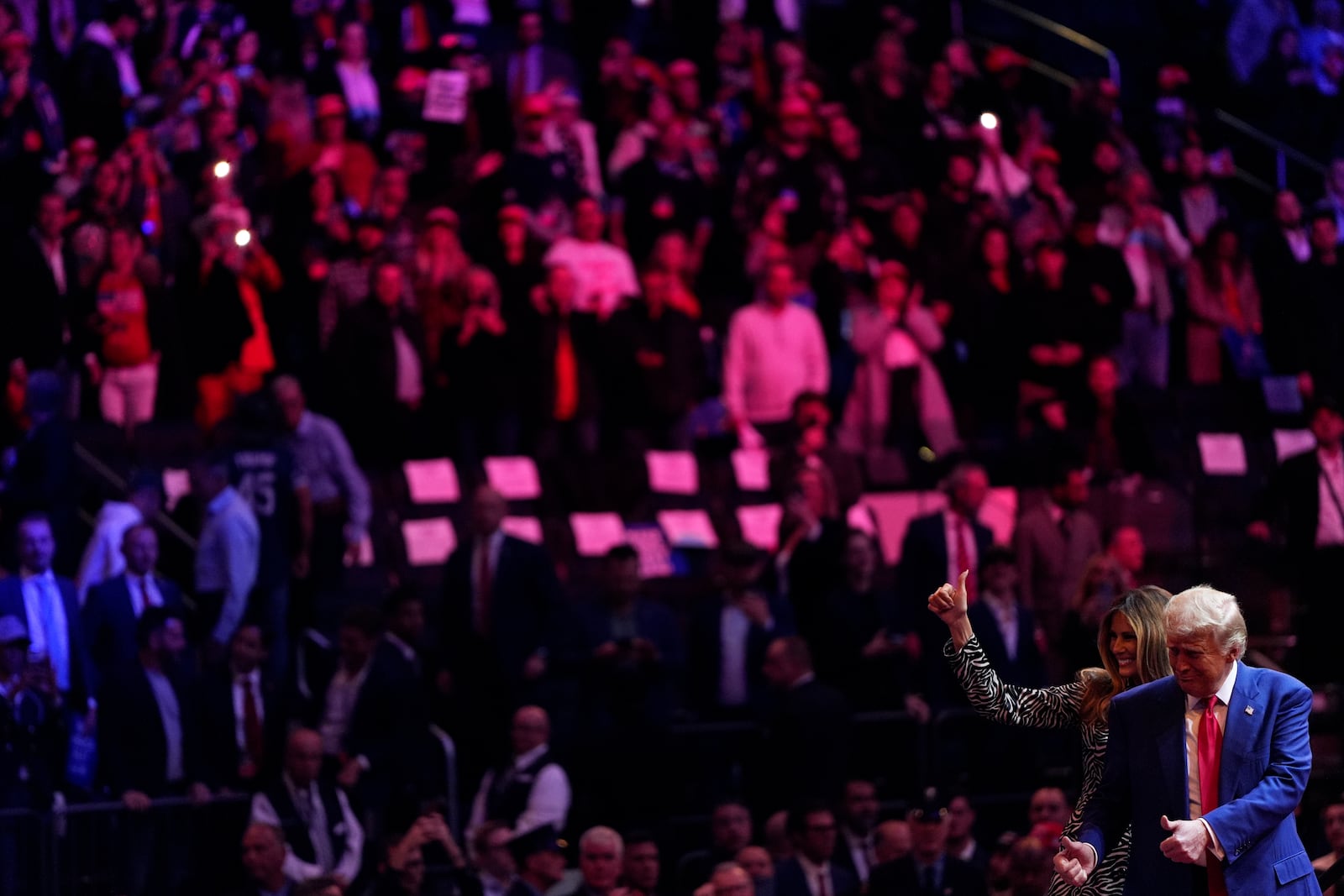 Republican presidential nominee former President Donald Trump and former first lady Melania Trump greet the crowd together during a campaign rally at Madison Square Garden, Sunday, Oct. 27, 2024, in New York. (AP Photo/Julia Demaree Nikhinson)