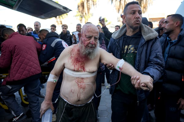 A Palestinian, wounded in the Israeli bombardment of the Gaza Strip, arrives at the Al-Aqsa Hospital in Deir al-Balah, Monday, Dec. 16, 2024. (AP Photo/Abdel Kareem Hana)