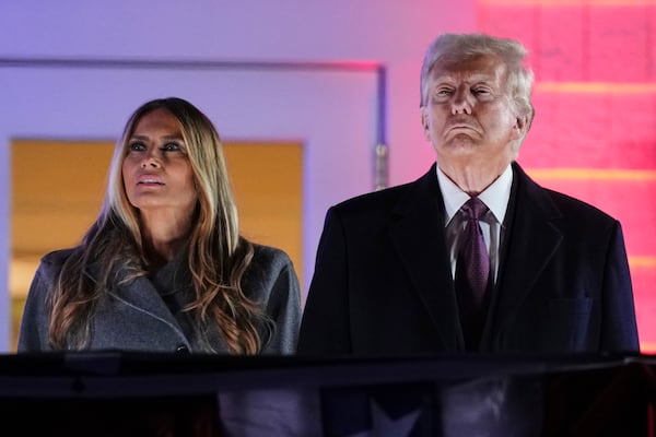 President-elect Donald Trump, right, and Melania Trump watch fireworks at Trump National Golf Club in Sterling, Va., Saturday, Jan. 18, 2025, ahead of the 60th Presidential Inauguration. (AP Photo/Matt Rourke)