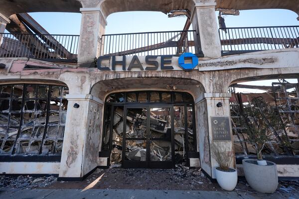 FILE - A Chase Bank branch destroyed by the Palisades Fire is seen in the Pacific Palisades neighborhood of Los Angeles, Monday, Jan. 13, 2025. (AP Photo/Richard Vogel, File)