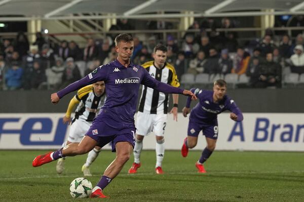 Fiorentina's Albert Gudmundsson scores his side's seventh goal during the Europa Conference League opening phase soccer match between Fiorentina and LASK at the Artemio Franchi Stadium in Florence, Italy, Thursday Dec. 12, 2024. (Massimo Paolone/LaPresse via AP)