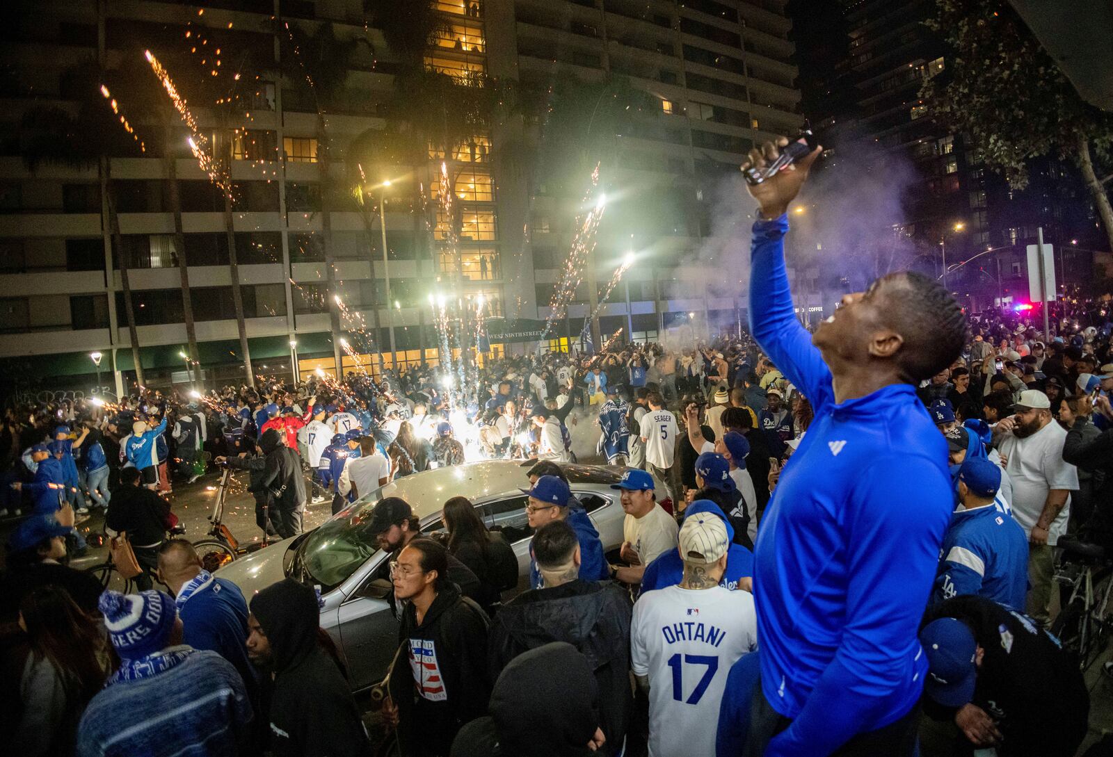 Fireworks go off as fans celebrate on the streets after the Los Angeles Dodgers defeated the New York Yankees to win the baseball World Series Wednesday, Oct. 30, 2024, in Los Angeles. (AP Photo/Ethan Swope)