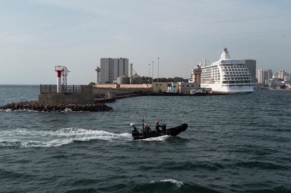 Senegalese sailors in their zodiac return to port following a mission to search for illegal migrant boats near the coast of Dakar, Senegal, Saturday, Nov.16, 2024. (AP Photo/Sylvain Cherkaoui)