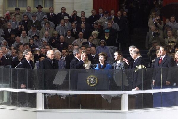 FILE - Vice President Al Gore, far right, who conceded to Republican George W. Bush after 36 days of legal battling over Florida's ballots, looks on as Bush is sworn in as the 43rd president of the United States, outside the U.S. Capitol in Washington, Jan. 20, 2001. (AP Photo/Ron Edmonds, File)