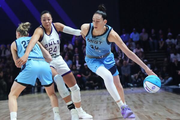 Mist's Breanna Stewart (30) dribbles around Owls' Napheesa Collier (24), during the first half of an Unrivaled 3-on-3 basketball game, Friday, Jan. 17, 2025, in Medley, Fla. (AP Photo/Marta Lavandier)