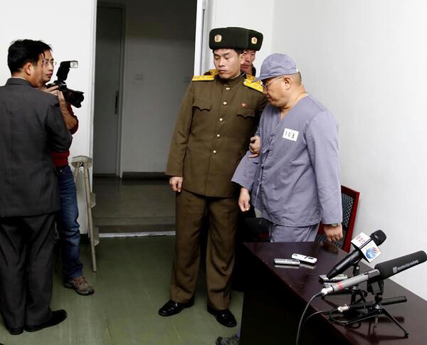 FILE - American missionary Kenneth Bae, right, leaves after speaking to reporters at Pyongyang Friendship Hospital in Pyongyang, North Korea, Jan. 20, 2014. (AP Photo/Kim Kwang Hyon, File)