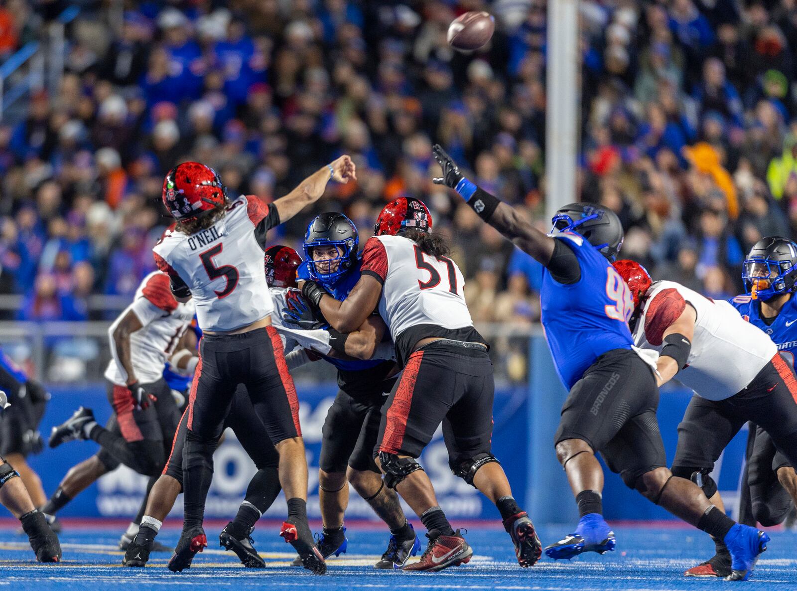 San Diego State wide quarterback Danny O'Neil makes a rushed pass that goes incomplete with pressure from Boise State nose tackle Herbert Gums during the first half of an NCAA college football game, Friday, Nov. 1, 2024 in Boise, Idaho. (Darin Oswald/Idaho Statesman via AP)