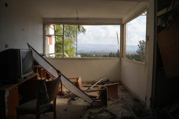 Damage is seen at the site where a rocket fired from Lebanon hit a residential building in Kiryat Shmona, a town located near the border with Lebanon, in northern Israel, Wednesday, Nov. 20, 2024. (AP Photo/Ohad Zwigenberg)