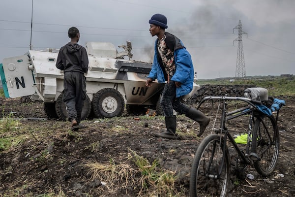 A UN armoured personnel carrier burns, during clashes with M23 rebels outside Goma, Democratic Republic of the Congo, Saturday, Jan. 25, 2024. (AP Photo/Moses Sawasawa)