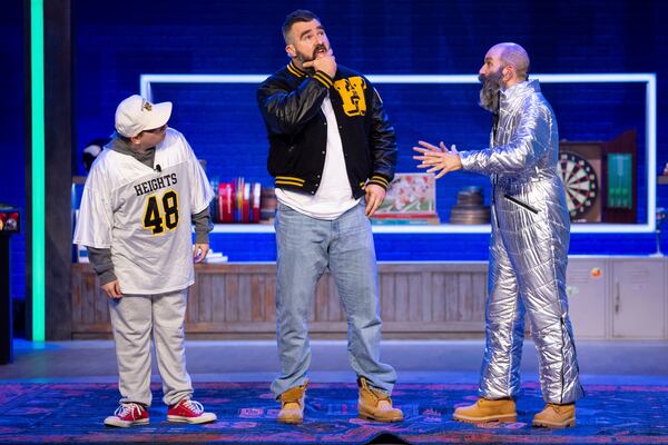 Former NFL player and ESPN analyst Jason Kelce, center, performs a skit with a younger and older version of himself during the taping of "They Call It Late Night with Jason Kelce", Friday, Jan. 3, 2025, in Philadelphia. (AP Photo/Chris Szagola)