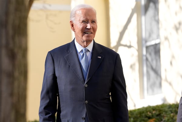 President Joe Biden listens to a question from a reporter after walking out of St. John's Church in Washington, Friday, Jan. 17, 2025. (AP Photo/Alex Brandon)