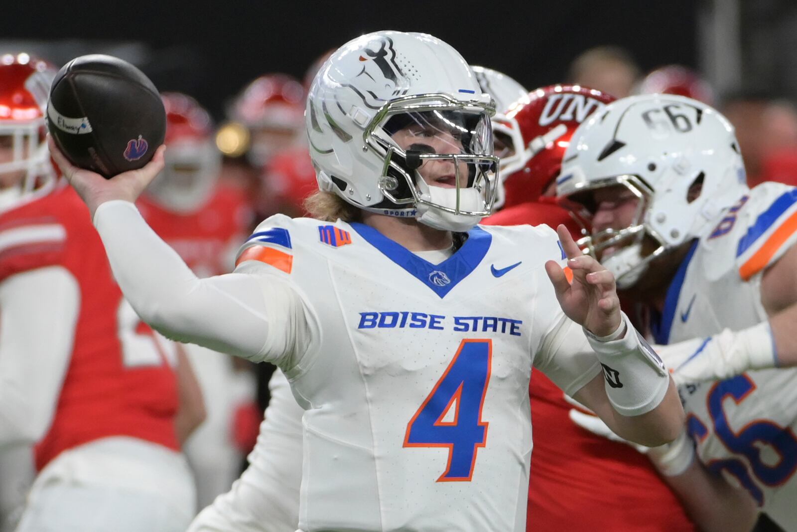 Boise State Broncos quarterback Maddux Madsen (4) throws against the UNLV Rebels during the first half of an NCAA football game Friday, Oct. 25, 2024, in Las Vegas. (AP Photo/Sam Morris)