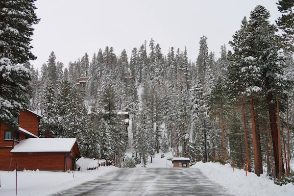 In this photo provided by Mammoth Mountain, snow is cleared from a road Saturday, Nov. 23, 2024, in Mammoth Lakes, Calif. (Samantha Lindberg/Visit Mammoth via AP)