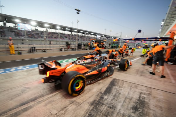 McLaren driver Oscar Piastri of Australia enters the pit during practice at the Lusail International Circuit in Lusail, Qatar, ahead of the Qatar Formula One Grand Prix, Friday, Nov. 29, 2024. (AP Photo/Darko Bandic)