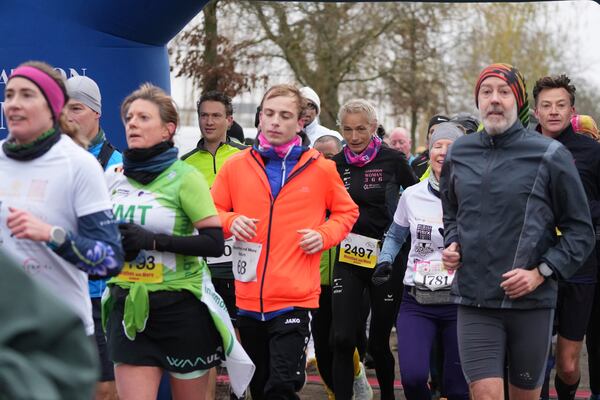 Belgian ultra runner Hilde Dosogne, center, runs with the pack during her 366th consecutive marathon in Ghent, Belgium, Tuesday, Dec. 31, 2024. (AP Photo/Virginia Mayo)