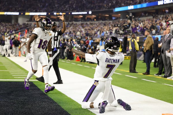 Baltimore Ravens wide receiver Rashod Bateman (7) celebrates his touchdown catch with wide receiver Diontae Johnson (18) during the first half of an NFL football game against the Los Angeles Chargers, Monday, Nov. 25, 2024, in Inglewood, Calif. (AP Photo/Ryan Sun)