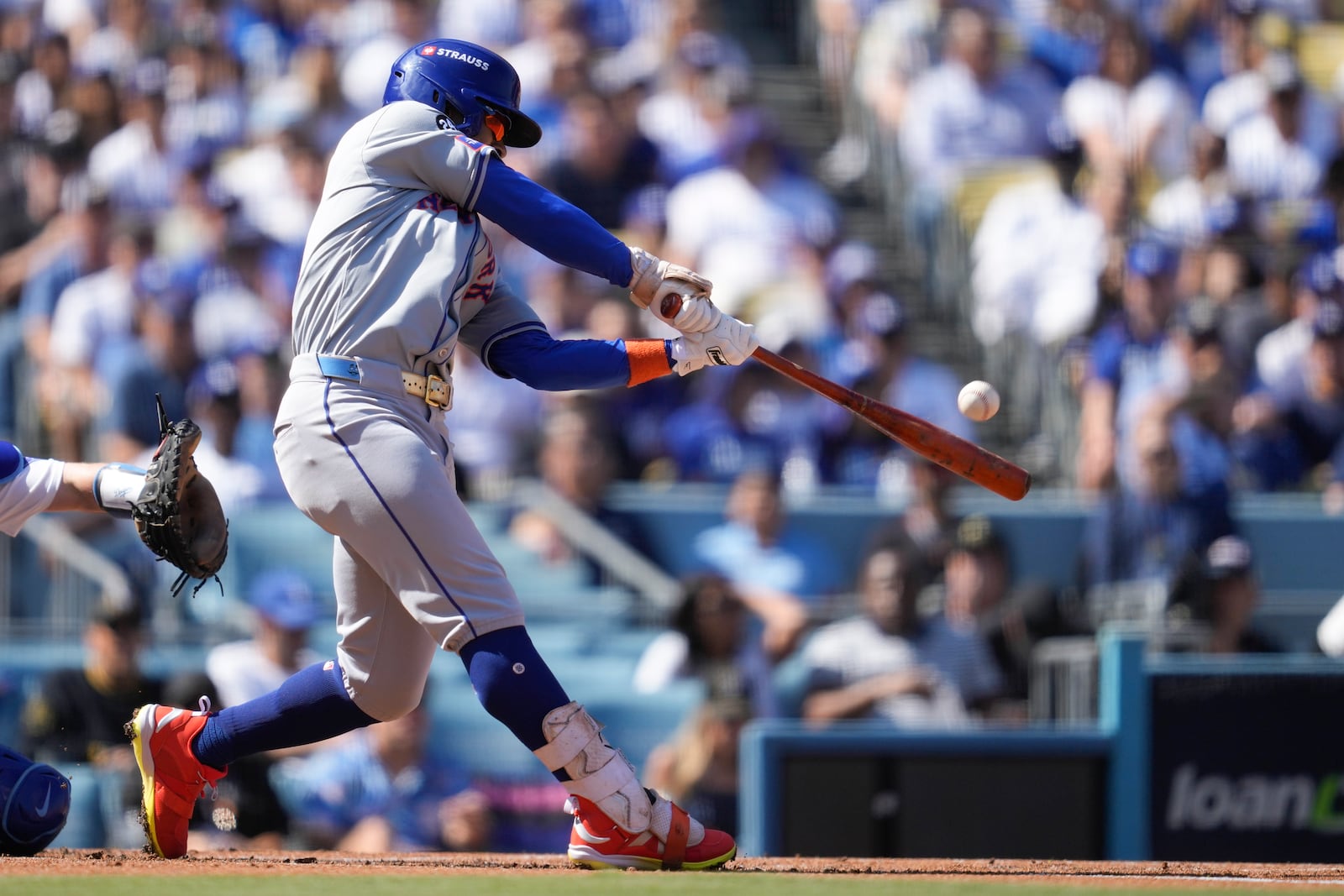 New York Mets' Francisco Lindor connects for a solo home run against the Los Angeles Dodgers during the first inning in Game 2 of a baseball NL Championship Series, Monday, Oct. 14, 2024, in Los Angeles. (AP Photo/Ashley Landis)