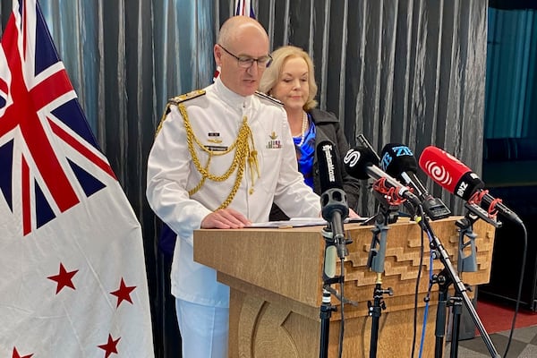 New Zealand Chief of Navy Rear Admiral Garin Golding, left, and Defense Minister Judith Collins hold a press conference in Auckland, Friday, Nov. 29, 2024, following the preliminary findings of the military Court of Inquiry into the sinking of a New Zealand navy ship on a Samoan reef in October. (Lawrence Smith/Stuff via AP)