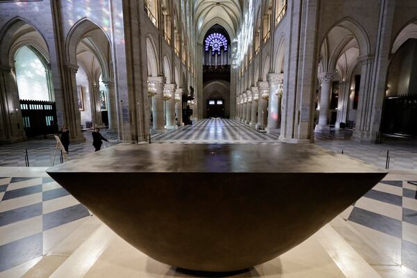 The altar designed by French artist and designer Guillaume Bardet is seen in the heart of Notre-Dame de Paris cathedral while French President Emmanuel Macron visits the restored interiors of the monument, Friday Nov. 29, 2024, in Paris. (Stephane de Sakutin, Pool via AP)