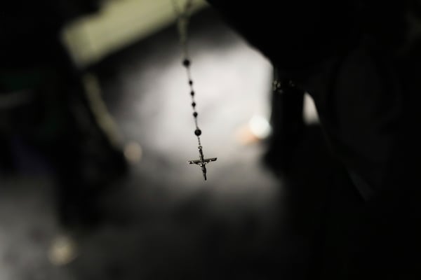 A rosary is seen on a creation displayed during the exhibition "From the Heart to the Hands: Dolce&Gabbana" at the Grand Palais, in Paris, Thursday, Jan. 9, 2025. (AP Photo/Thibault Camus)