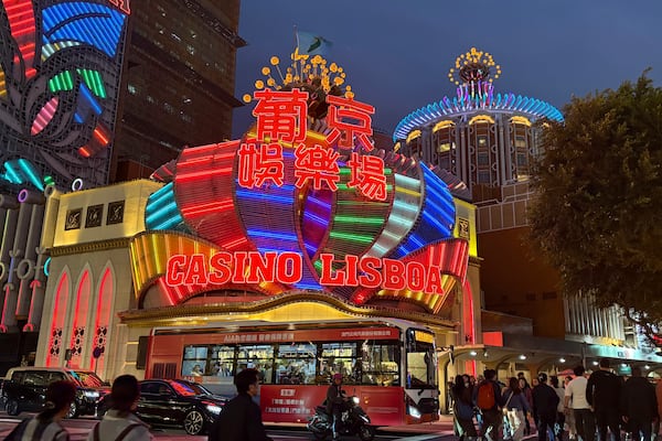 Heavy traffic outside the Casino Lisboa in Macao on Dec. 13, 2024. (AP Photo/Kanis Leung)