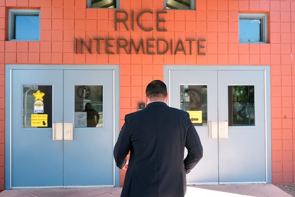 Rice Intermediate School Principal Nicholas Ferro walks to the main building on campus Tuesday, Aug. 27, 2024, in San Carlos, Ariz. (AP Photo/Ross D. Franklin)