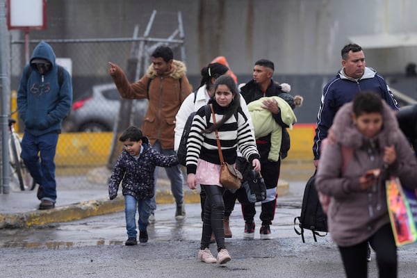 Migrants seeking asylum leave an immigration office after their scheduled meetings were canceled and they were turned away soon after President Donald Trump canceled the CBP One app, Monday, Jan. 20, 2025, in Matamoros, Mexico. (AP Photo/Eric Gay)