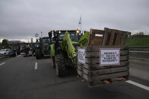 Farmers block a speedway to protest the EU-Mercosur trade agreement, Monday, Nov. 18, 2024 in Velizy-Villacoublay outside Paris. (AP Photo/Christophe Ena)