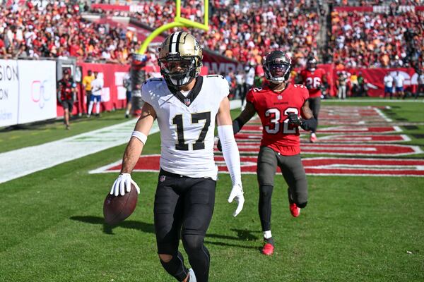 New Orleans Saints wide receiver Dante Pettis (17) pulls in a touchdown reception during the first half of an NFL football game against the Tampa Bay Buccaneers Sunday, Jan. 5, 2025, in Tampa, Fla. (AP Photo/Jason Behnken)