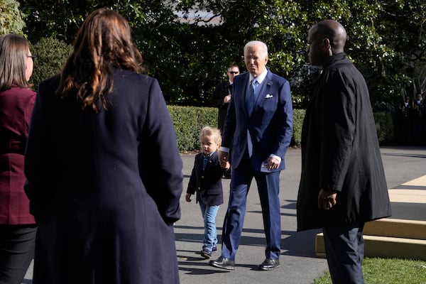 President Joe Biden, center right, departs with his grandson Beau Biden after pardoning the national Thanksgiving turkeys during a ceremony on the South Lawn of the White House in Washington, Monday, Nov. 25, 2024. (AP Photo/Mark Schiefelbein)