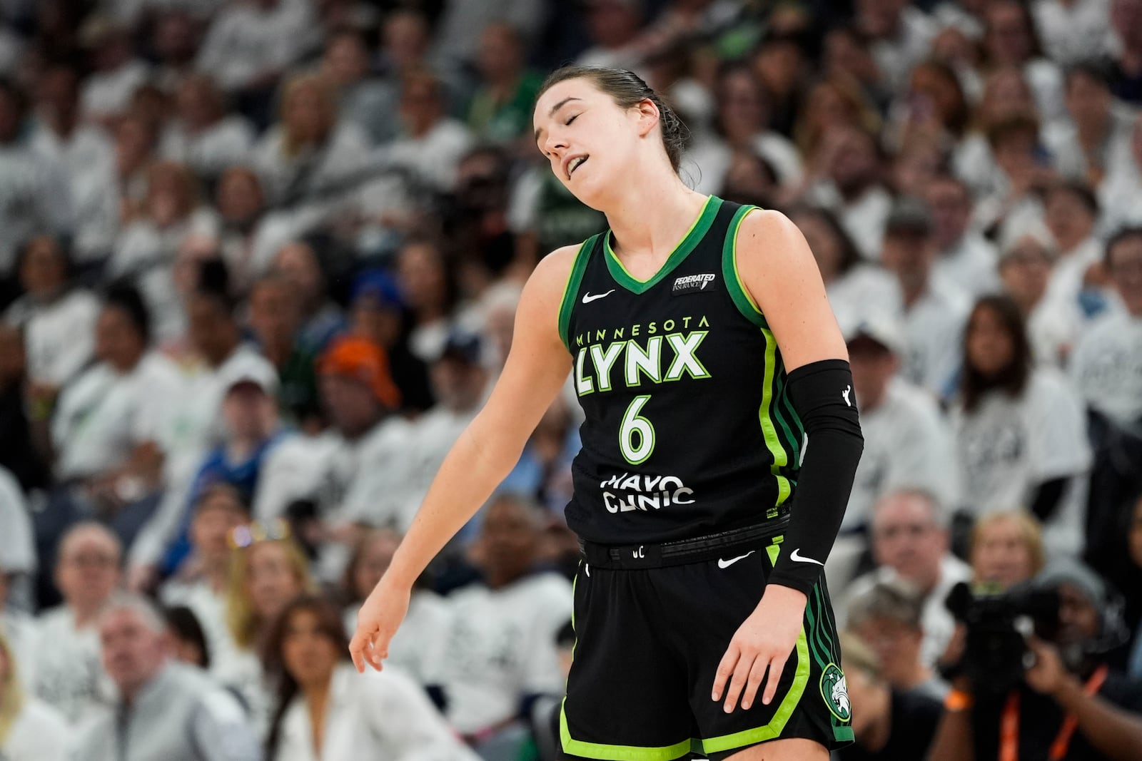 Minnesota Lynx forward Bridget Carleton (6) reacts after missing a basket against the New York Liberty during the second half of Game 4 of a WNBA basketball final playoff series, Friday, Oct. 18, 2024, in Minneapolis. (AP Photo/Abbie Parr)