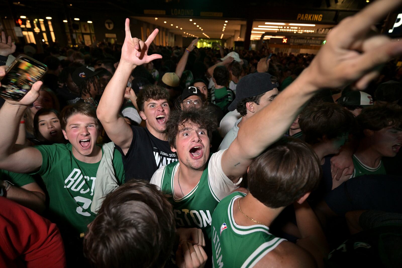 FILE - Boston Celtics fans react following the Celtics victory over the Dallas Mavericks in Game 5 of the NBA basketball finals in Boston on Monday, June 17, 2024. (AP Photo/Josh Reynolds, File)