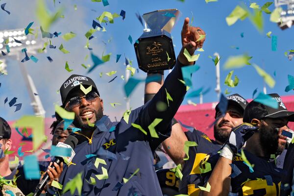 Michigan head coach Sherrone Moore celebrates after his team defeated Alabama to win the ReliaQuest Bowl NCAA college football game Tuesday, Dec. 31, 2024, in Tampa, Fla. (AP Photo/Chris O'Meara)