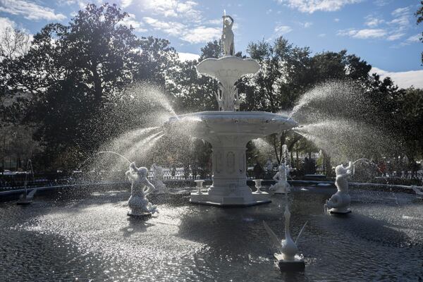 Ice clings to the sculptures in the historic fountain at Forsyth Park after a rare snow storm, Wednesday, Jan. 22, 2025, in Savannah, Ga. (AP Photo/Stephen B. Morton)