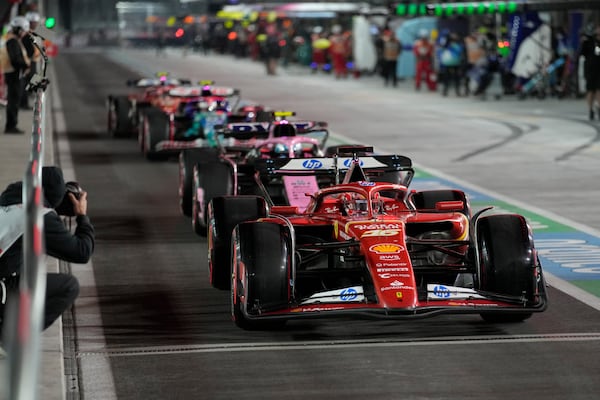 Ferrari driver Charles Leclerc, of Monaco, leaves the pits during qualifications for the Formula One U.S. Grand Prix auto race, Friday, Nov. 22, 2024, in Las Vegas. (AP Photo/John Locher)