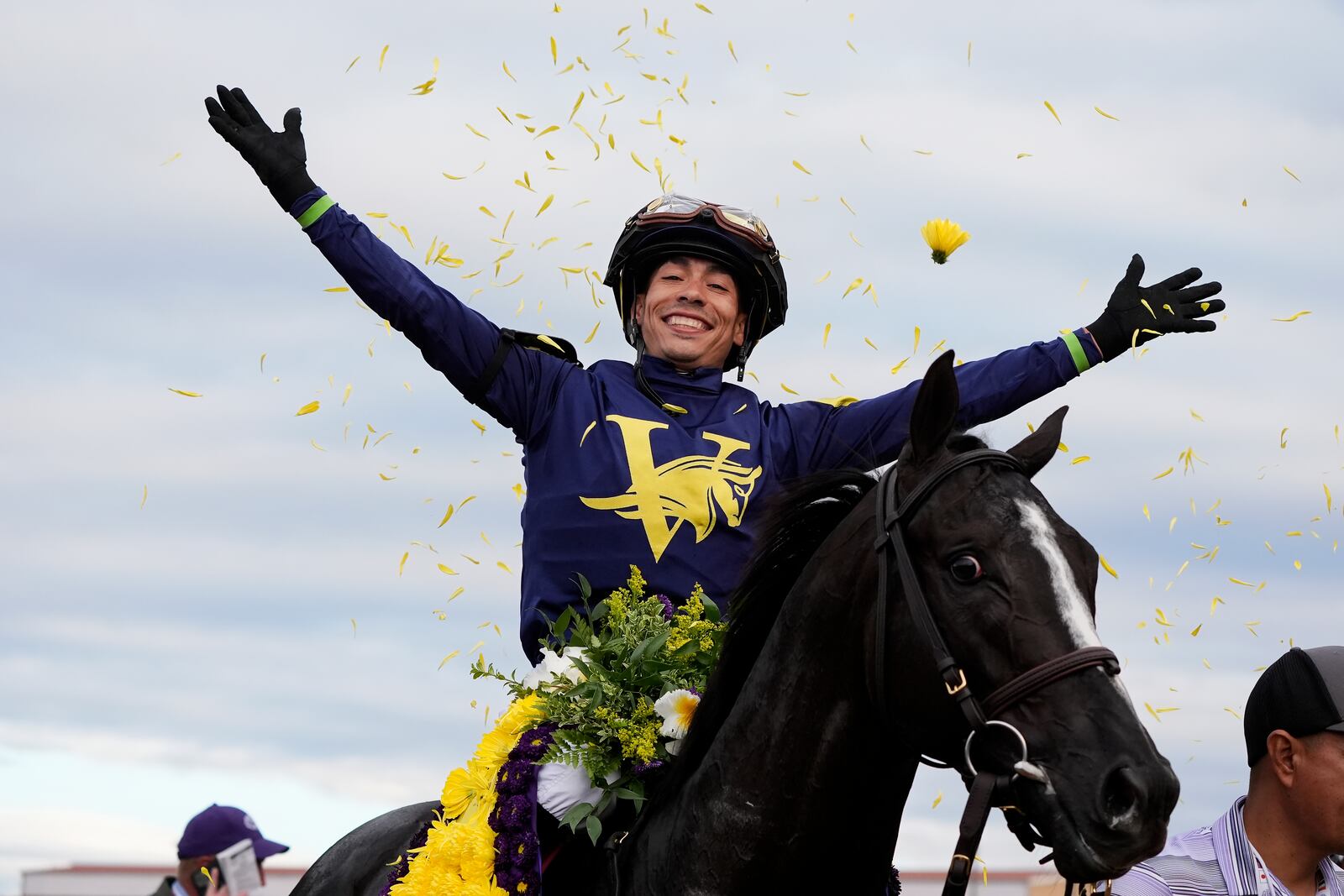 Jose Ortiz celebrates after riding More Than Looks to victory in the Breeders' Cup Mile horse race in Del Mar, Calif., Saturday, Nov. 2, 2024. (AP Photo/Gregory Bull)