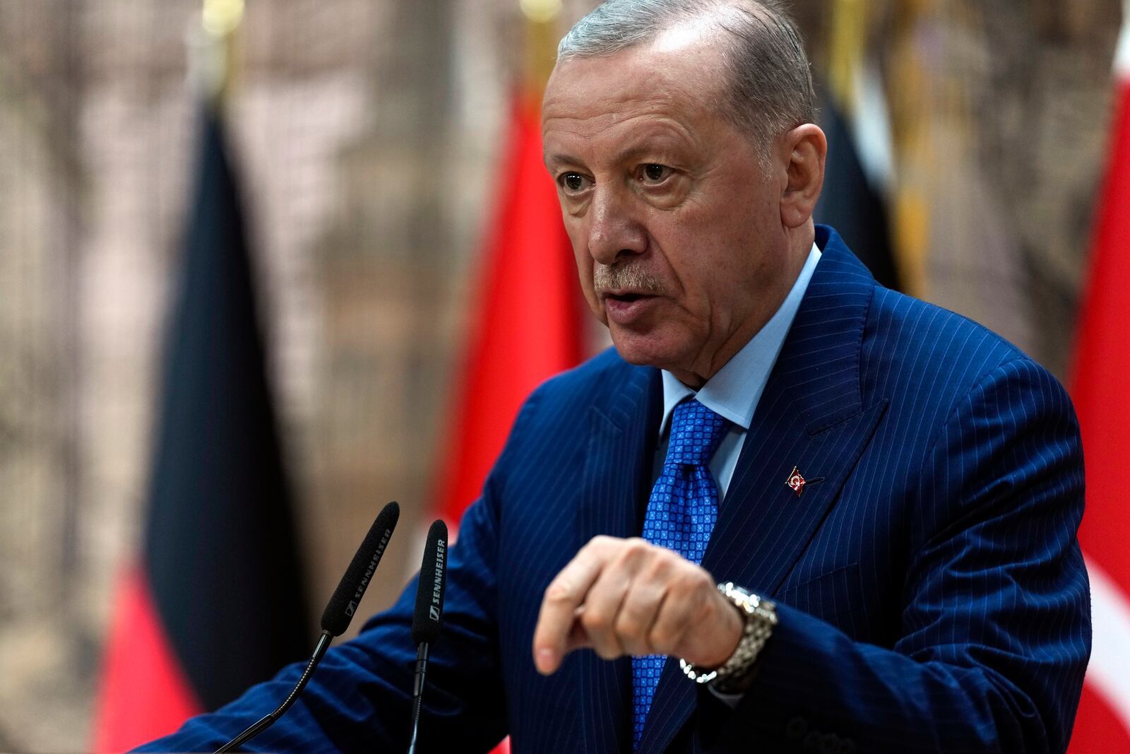 Turkey's President Recep Tayyip Erdogan, right, answers journalists' questions during a presser with Germany's Chancellor Olaf Scholz, in Istanbul, Turkey, Saturday, Oct. 19, 2024. (AP Photo/Khalil Hamra)