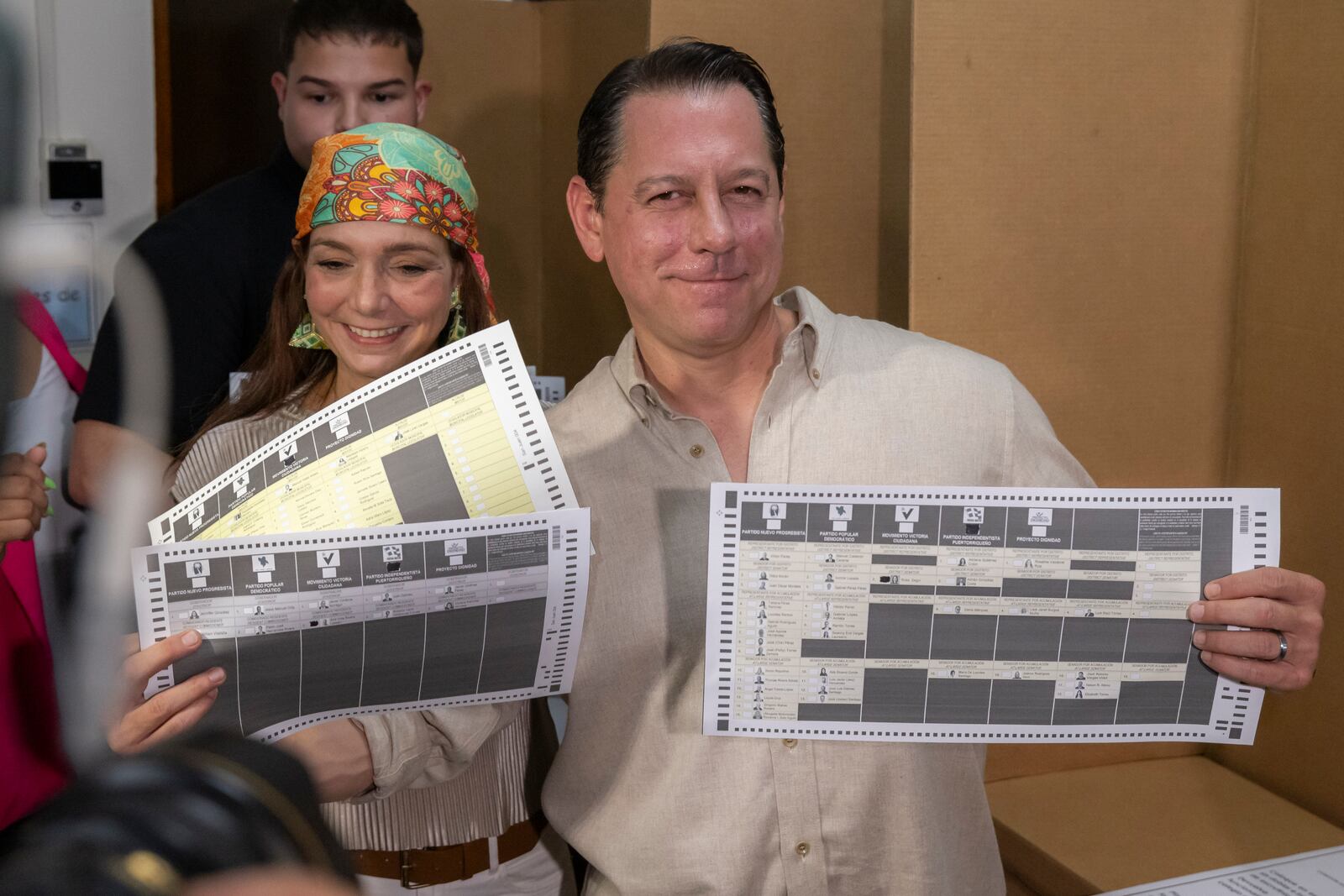 Juan Dalmau, Puerto Rico's Independence Party candidate for Governor, shows his ballots during general elections in San Juan, Puerto Rico, Tuesday, Nov. 5, 2024. (AP Photo/Alejandro Granadillo)