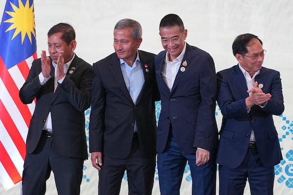 From left to right, Myanmar's Permanent Secretary to ASEAN Aung Kyaw Moe, Singapore's Foreign Minister Vivian Balakrishnan, Thailand's Foreign Minister Maris Sangiampongsa and Vietnam's Foreign Minister Bui Thanh Son react after a group photo session during the Association of Southeast Asian Nations (ASEAN) Foreign Ministers' Retreat in Langkawi Island, Malaysia, Sunday, Jan. 19, 2025. (AP Photo/Azneal Ishak, Pool)