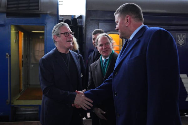 British Prime Minister Keir Starmer, left, is greeted by Ukrainian officials and the British ambassador to Ukraine Martin Harris, second right, as he arrives at a train station in Kyiv, Ukraine Thursday, Jan. 16, 2025. (Carl Court/Pool Photo via AP)