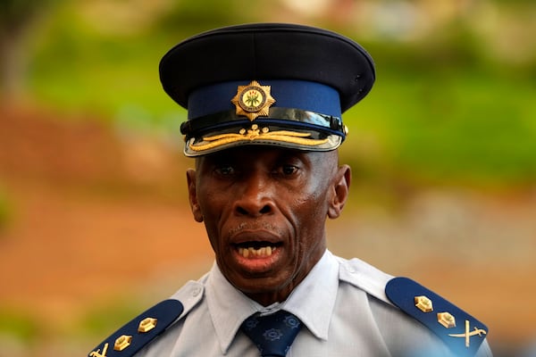 The Acting Provincial Commissioner of North West, Major General Patrick Asaneng, speaks to journalists outside an abandoned gold mine, where miners are rescued from below ground, in Stilfontein, South Africa, Wednesday, Jan. 15, 2025. (AP Photo/Themba Hadebe)