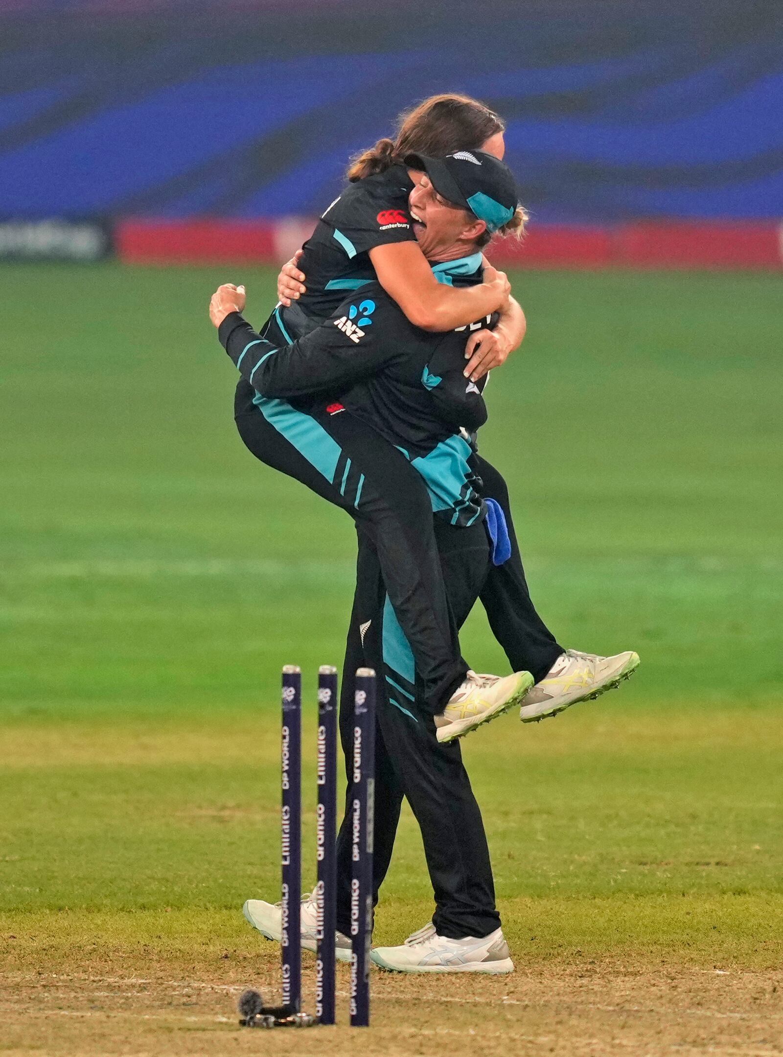 New Zealand's captain Sophie Devine, right, and teammate Eden Carson celebrate after winning the ICC Women's T20 World Cup 2024 final match against South Africa at Dubai, United Arab Emirates, Sunday, Oct. 20, 2024. (AP Photo/Altaf Qadri)