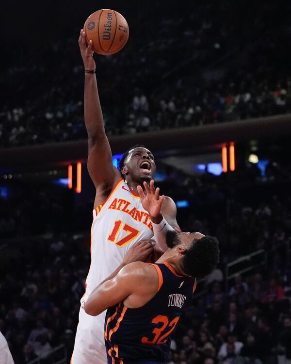 Atlanta Hawks' Onyeka Okongwu (17) shoots over New York Knicks' Karl-Anthony Towns (32) during the first half of an Emirates NBA Cup basketball game Wednesday, Dec. 11, 2024, in New York. (AP Photo/Frank Franklin II)